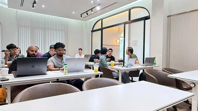 Community builders collaborating in small groups at OpenAI Build Week Chiang Mai